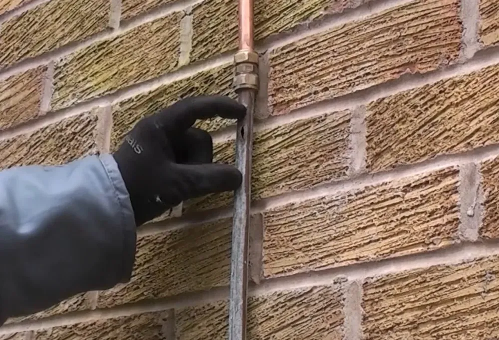 Master plumber performing burst pipe repair in Allen TX